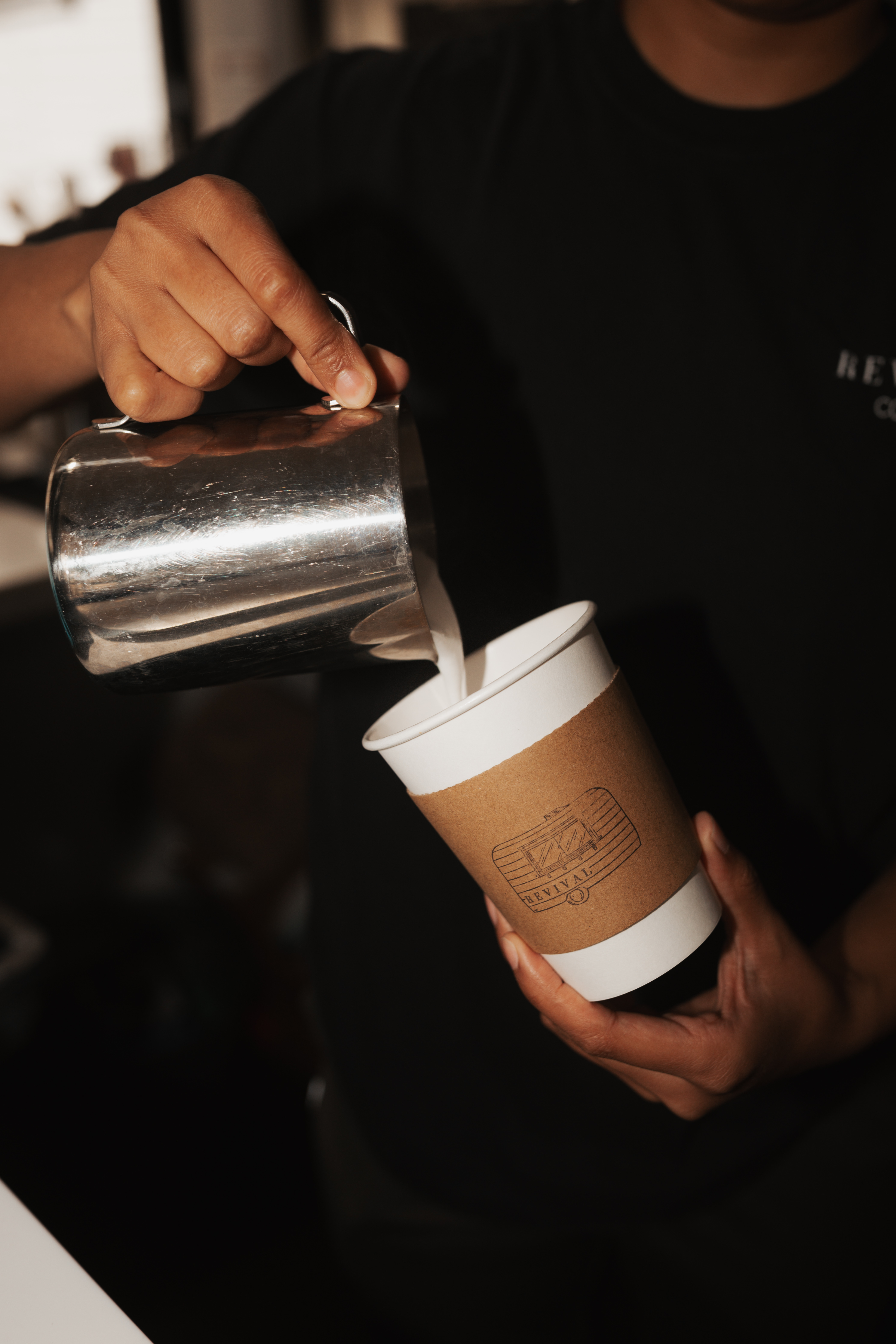 Coffee being steamed and prepared at Revival Coffee Savannah