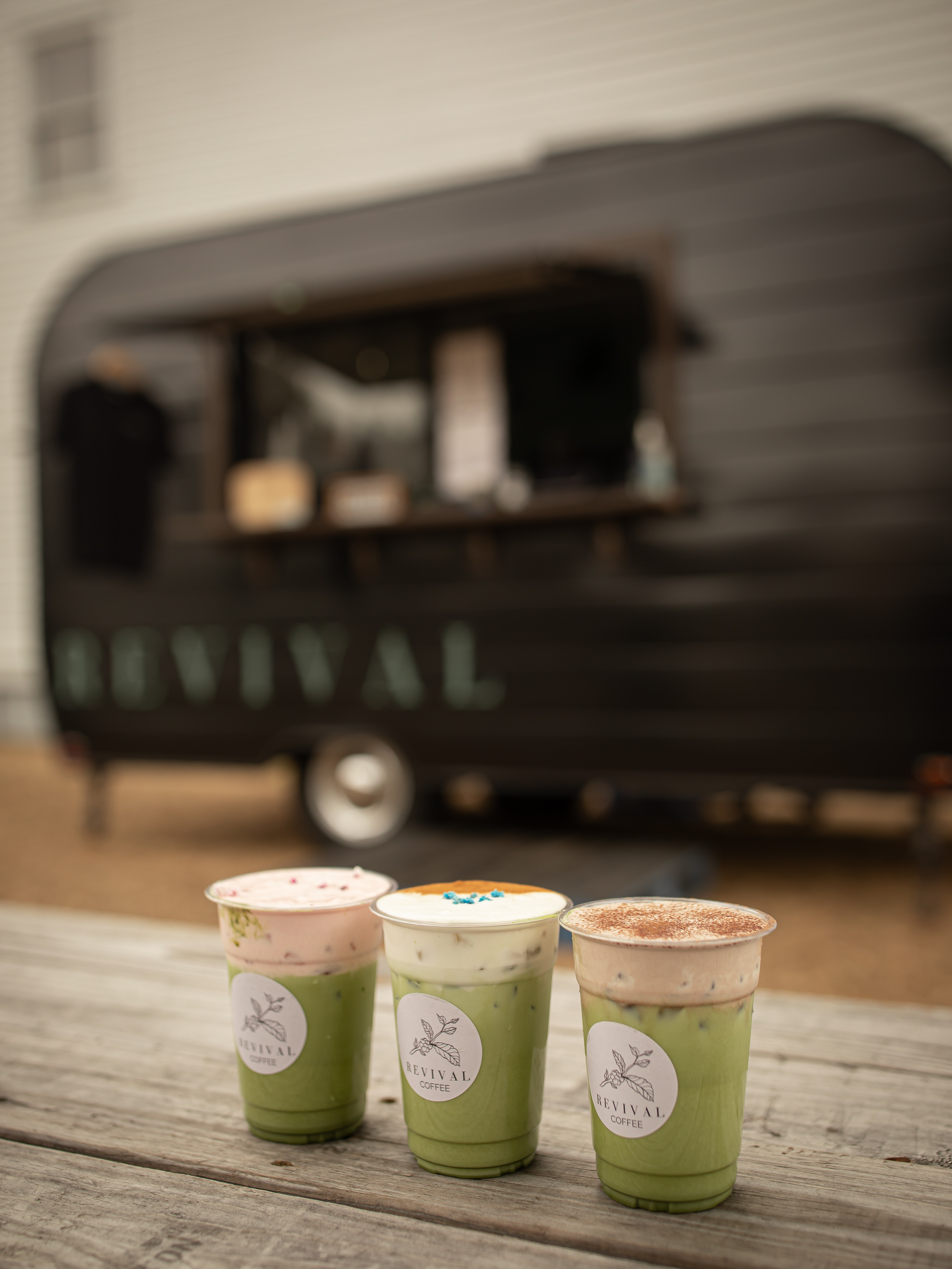 Specialty matcha drinks on counter at Revival Coffee Midtown location