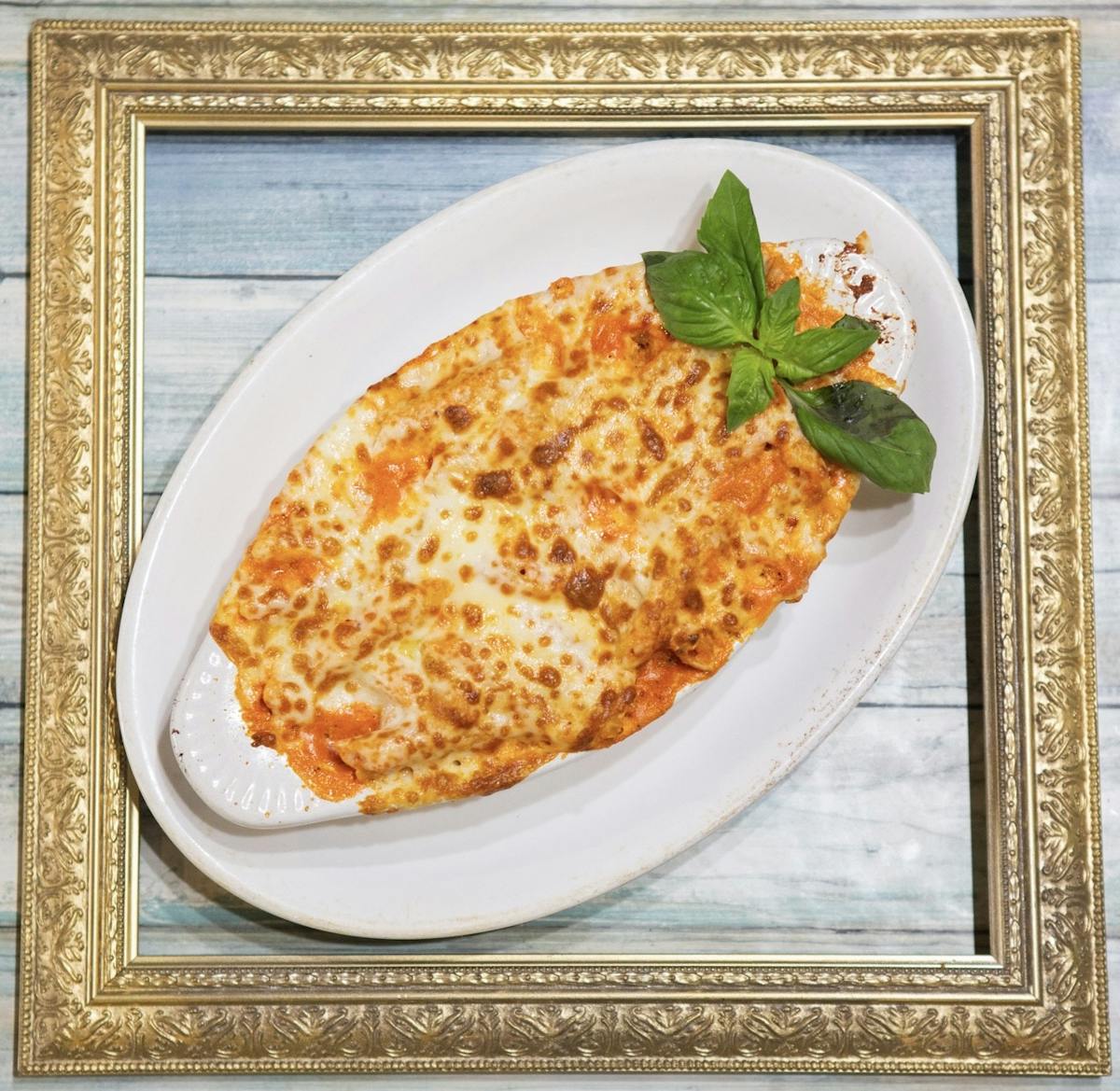 Baked ziti with marinara, mozzarella, and ricotta — classic Italian pasta at Amici Brick Oven Pizza, West Palm Beach