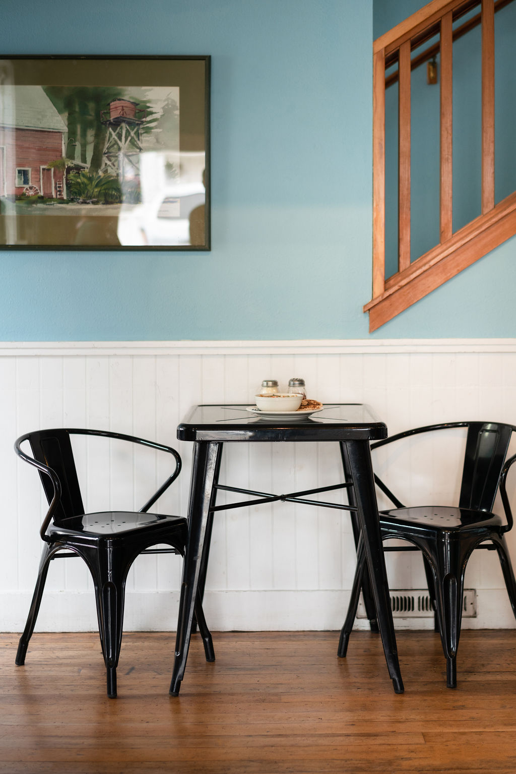 Table in chairs inside Frankie's Pizza & Ice Cream in Mendocino, California.